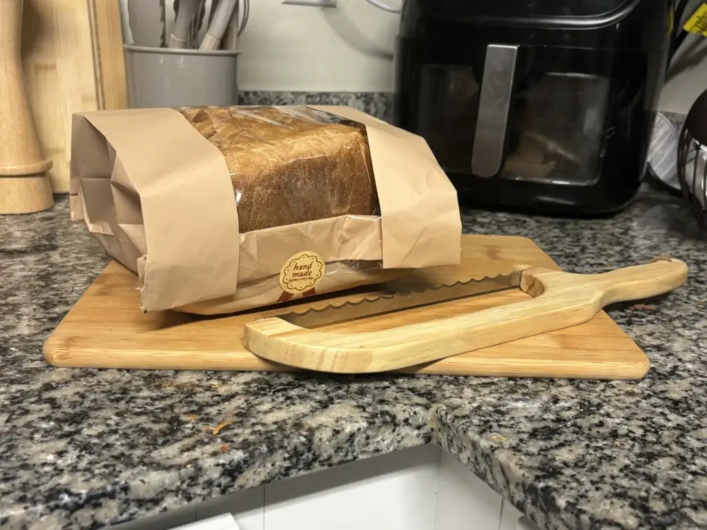 Multiple slices of homemade bread arranged on cutting board ready for family meals
