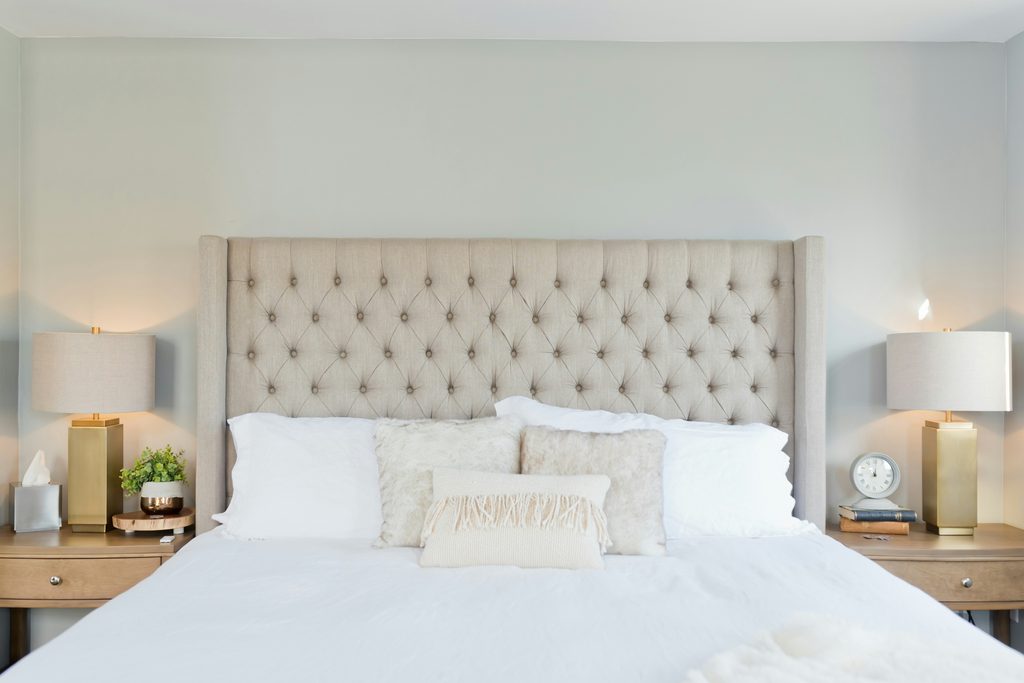 “Bed with white bedding and pillows.”